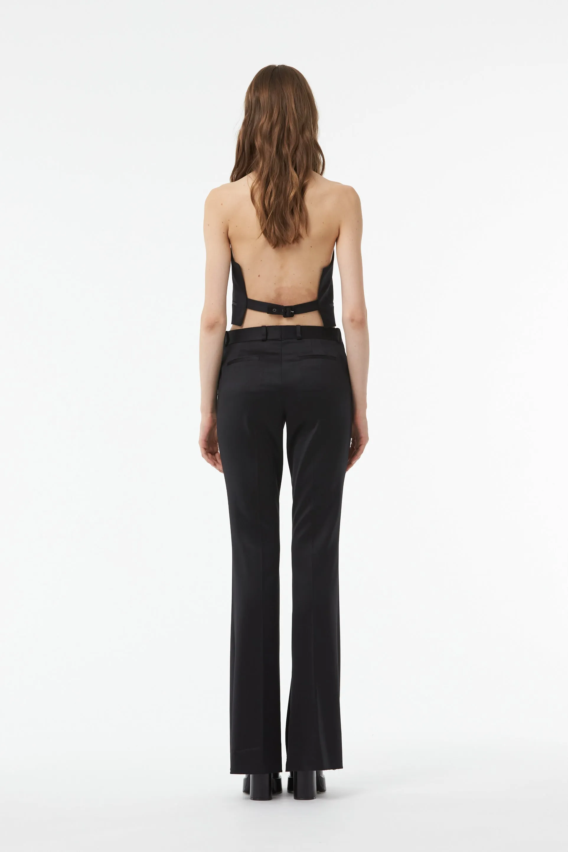 TAILORED FLARED PANTS WITH SLIT AT THE ANKLE IN BLACK WOOL TWILL