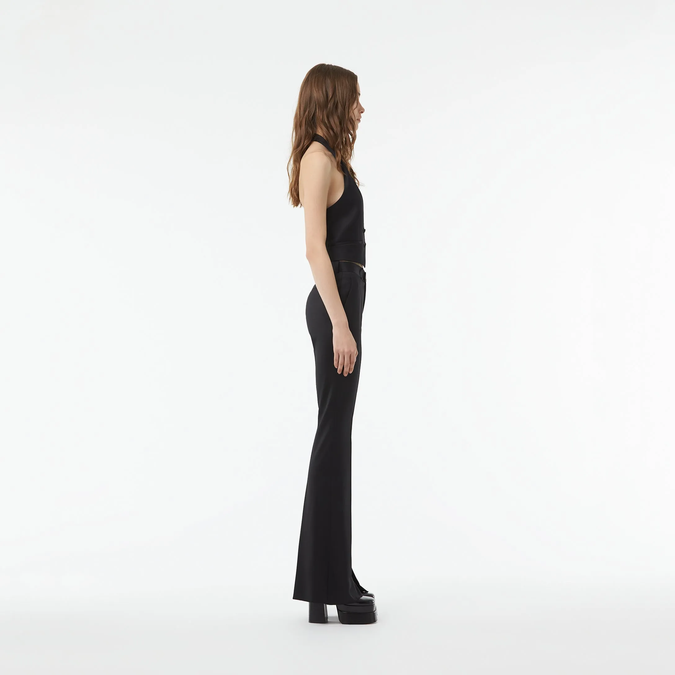 TAILORED FLARED PANTS WITH SLIT AT THE ANKLE IN BLACK WOOL TWILL