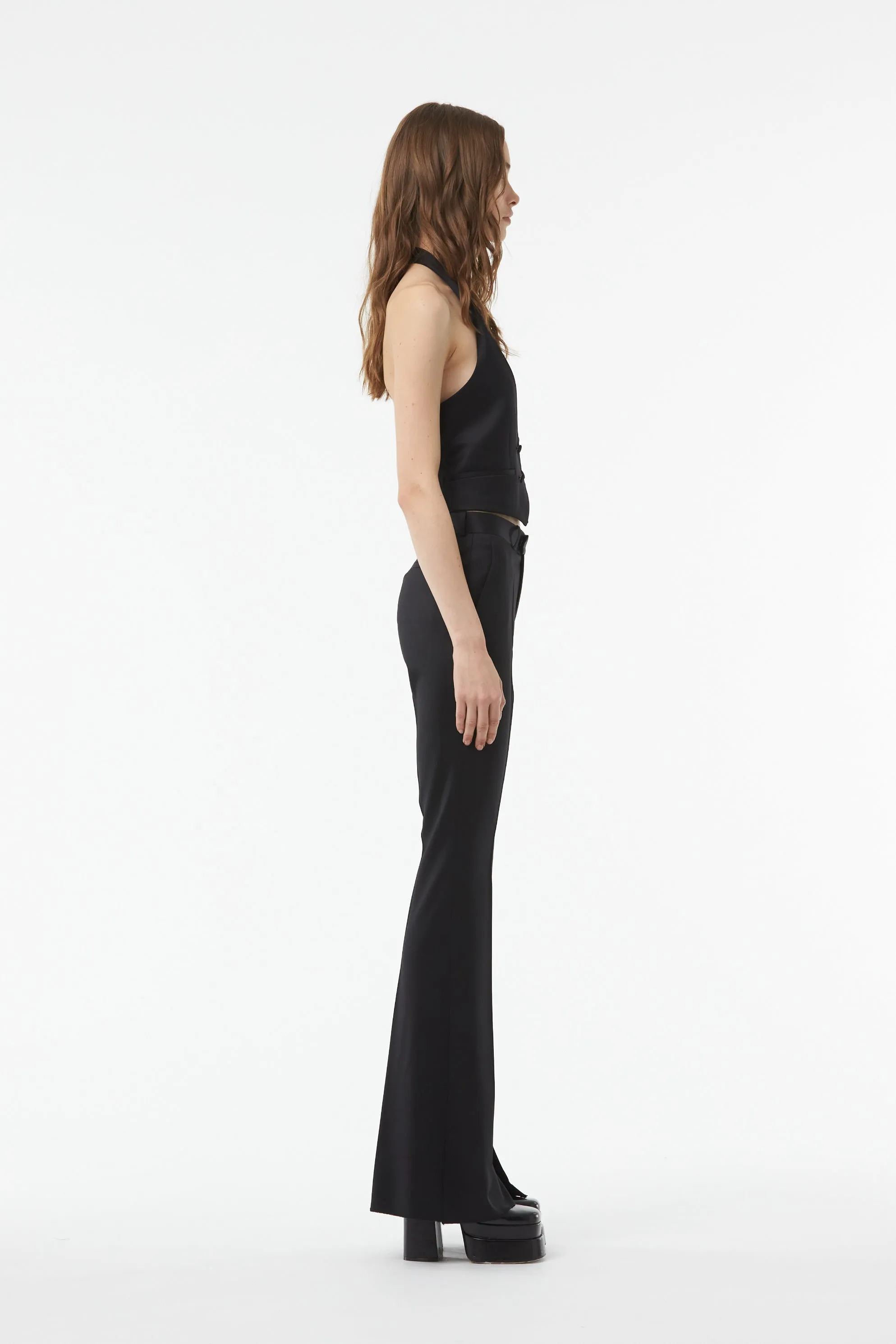 TAILORED FLARED PANTS WITH SLIT AT THE ANKLE IN BLACK WOOL TWILL