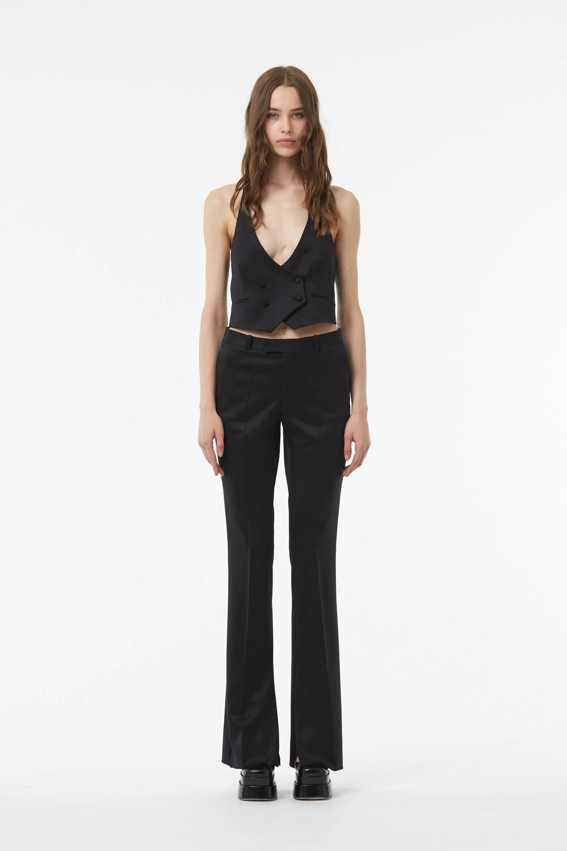 TAILORED FLARED PANTS WITH SLIT AT THE ANKLE IN BLACK WOOL TWILL