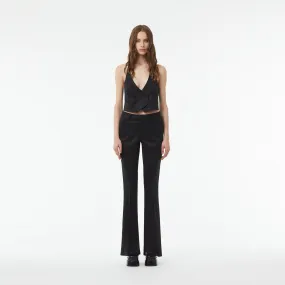 TAILORED FLARED PANTS WITH SLIT AT THE ANKLE IN BLACK WOOL TWILL